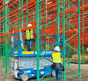 two IMH workers assembling pallet racks in a new warehouse