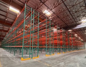 Green and orange pallet racks in a warehouse