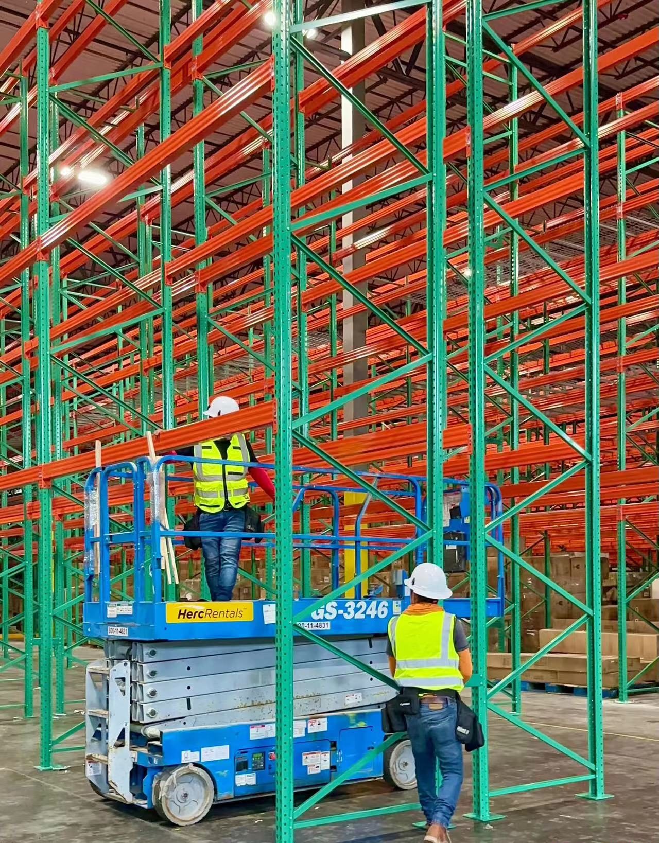 IMH-Install-Team IMH Workers installing pallet racks in a warehouse