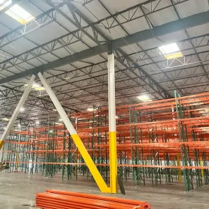 Mid-installation photo showing teardrop pallet racks and wire decks at the 68,000 sq ft Primax Wheels warehouse in Ontario, California.