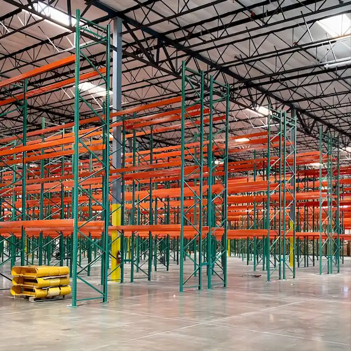 Pallet racking system installed in Fullerton warehouse with organized pallet storage and wide aisles